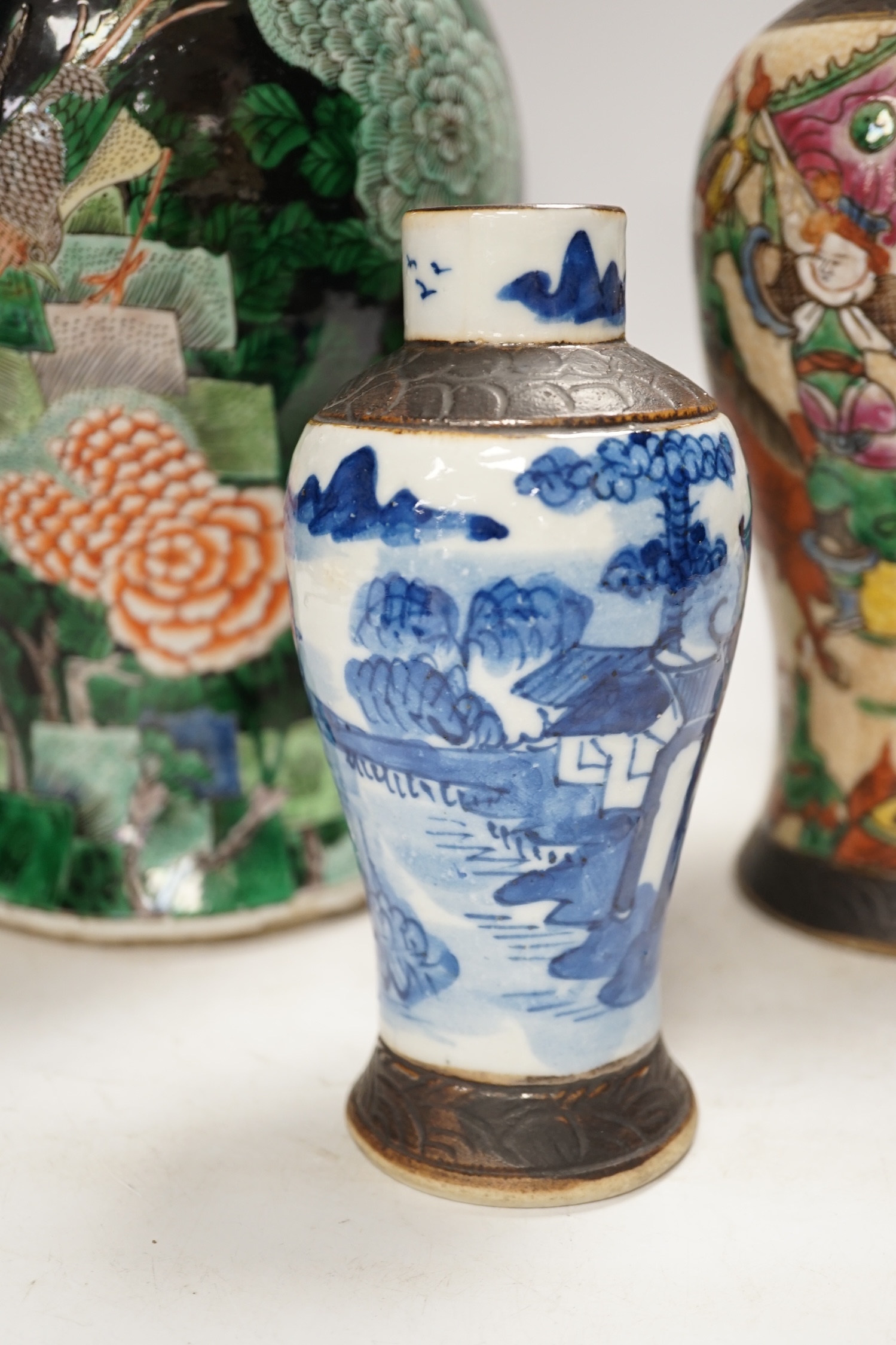 Three Chinese vases, 19th/early 20th century, including a cut down famille noire vase, crackleglaze and blue and white vases, tallest 34cm. Condition - fair to poor